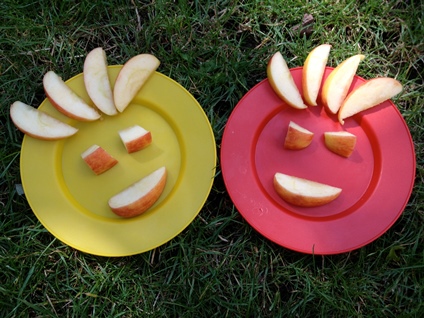 Apples cut into smiley faces